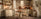 Practical Magic cosy autumn home styling blog banner shows round rustic wood table with matching wooden chairs in bright kitchen with white corner stair case