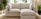 best layouts for small living rooms - 2 seater sofa with chaise footstool in small space with lots of plants