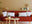 interior design trends blog header shows orange sofa in Scandi inspired room with round coffee table and pot plant