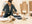 the history of flatpack furniture blog header image shows a woman building a flat pack sideboard