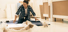 the history of flatpack furniture blog header image shows a woman building a flat pack sideboard