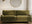 what colour goes with grey green and blue sofas - 3 seat green sofa with round mirror, gold arch floor lamp and round wood side table