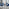 Enna White Glass Extending Dining Table and 4 Navy Pesaro Silver Leg Chairs