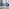 Enna White Glass Extending Dining Table and 4 Navy Pesaro Silver Leg Chairs