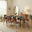 Leif Black Wood Extending Dining Table with 8 Tan Delta Chairs