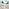 2x Milan Green Velvet Counter Stools Silver Legs