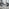 Enna White Glass Extending Dining Table and 4 Black Milan Chairs