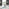 Novara Black Leg Round Glass Dining Table & 4 Grey Lorenzo Chairs