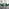 Novara 120cm Gold Round Dining Table and 6 Green Pesaro Black Leg Chairs