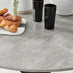 Novara Grey Concrete Effect Black Leg Round Dining Table & 4 Black Corona Black Leg Chairs