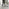 Novara White Marble Black Leg Round Dining Table & 4 Grey Milan Black Leg Chairs