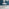 Novara White High Gloss Round Dining Table & 4 Grey Corona Silver Chairs