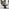 Palma Round Black Semi Gloss Dining Table 4 Grey Isola Chairs
