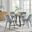Santorini Brown Round Dining Table And 4 Grey Pesaro Black Leg Chairs