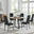 Santorini Brown Round Dining Table And 6 Black Milan Black Leg Chairs