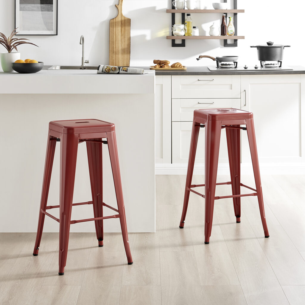 red metal tolix style stools at a kitchen island