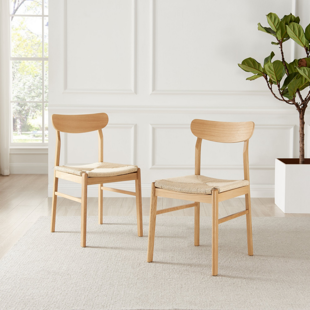 urban jungle furniture - pair of pale beech wood dining chairs with rope seat in white walled room, beside potted plant