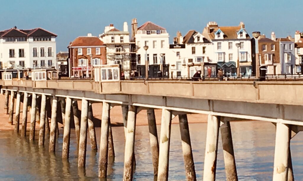 Deal, Kent, UK - voted 3rd most stylish location in the UK - beach with pier and buildings behind