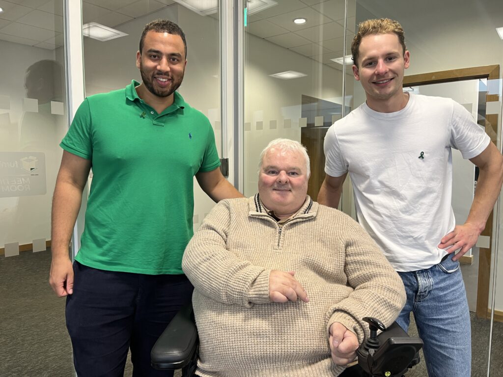 Dan Beckles, left, Black male in green shirt. Tony Peason, centre, white male in beige jumper, sat in wheelchair. Monty George, right, white male, white t-shirt. Discuss the importance of mental health. 