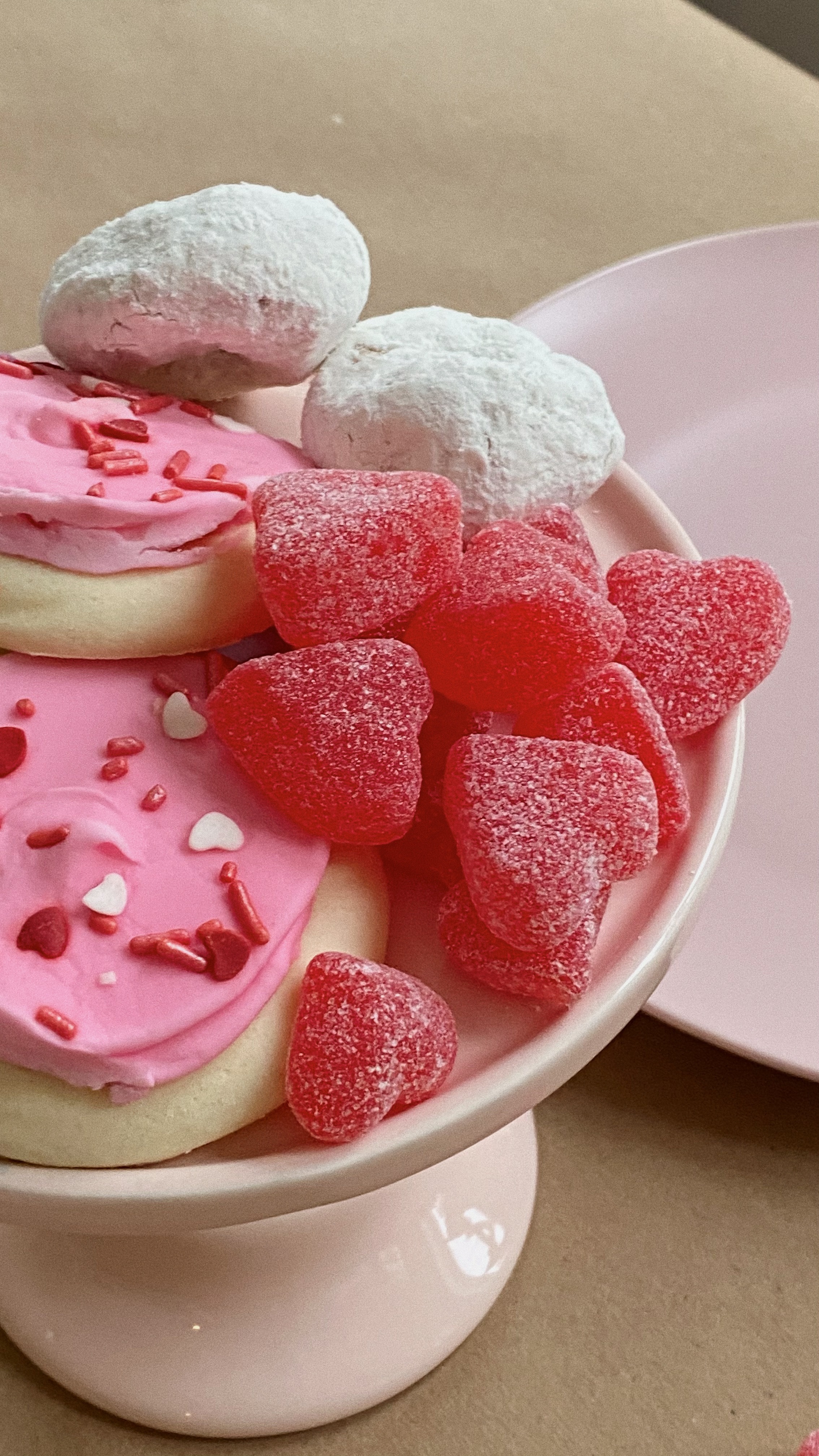 heart shaped sweets and cookies in white bowl for Valentine's Day